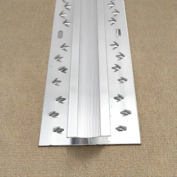 Double door trim for door bars, Surefit Carpets, showing a close-up of the sturdy aluminum finish and installation details.