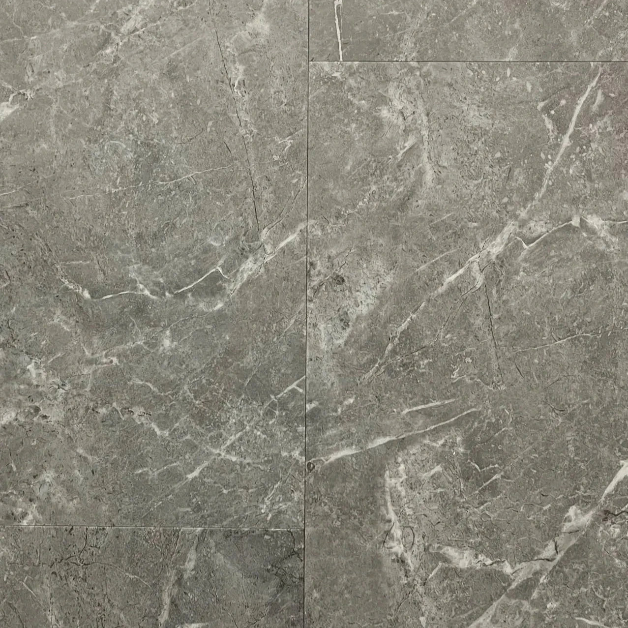 Spire Estyle Symphony Tile LVT flooring showing beige and gray wood-look planks with textured surface.