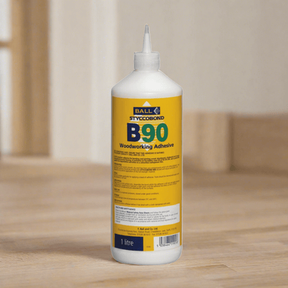 F. Ball & Co Styccobond B90 adhesive bottle, 1L or 5L, for flooring and carpet installation, showing the adhesive container and label.