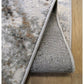 Abstract Burst Grey Rug by Surefit Carpets, close-up of textured grey rug with modern abstract pattern on soft fabric surface.