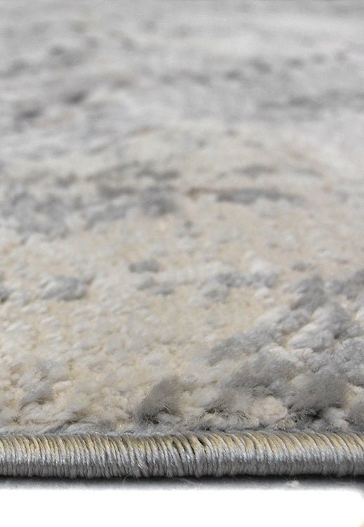 Abstract square grey rug by Surefit Carpets featuring a modern geometric design on soft woven fabric.