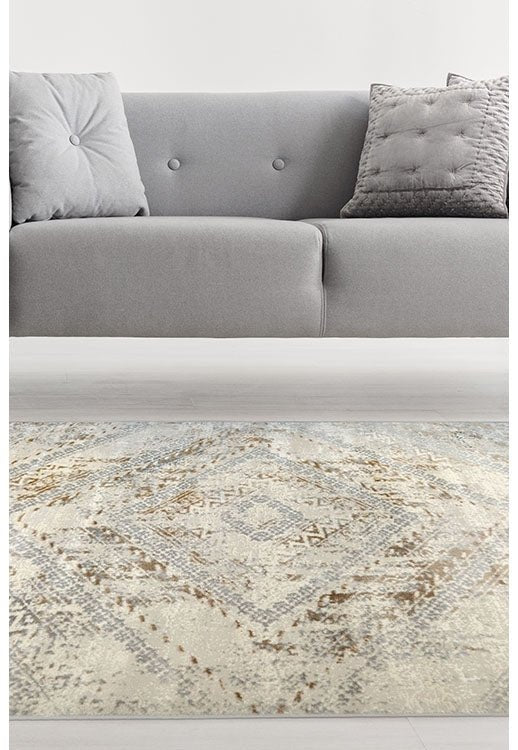 Abstract square ochre rug from Surefit Carpets featuring a bold geometric design in warm yellow and neutral tones.