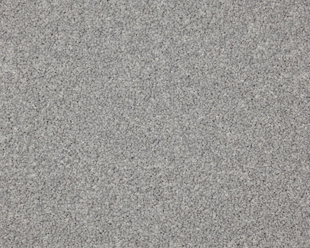 Inglewood Saxony carpet by Cormar Carpet Co, close-up of soft, plush beige and cream textured carpet fibers.