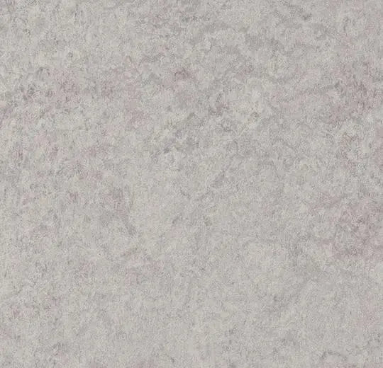 Novilon Viva Stone vinyl flooring by Forbo, showing a close-up of textured gray stone pattern for durable interior surfaces.
