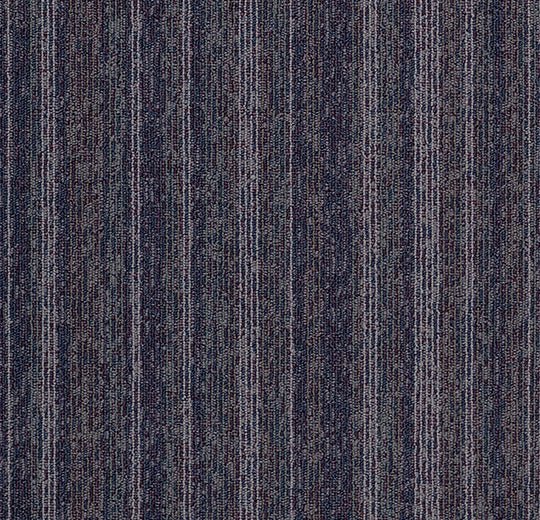 Forbo Tessera barcode pattern carpet tiles arranged in a grid, showcasing their modern design and versatile flooring option.