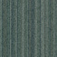 Forbo Tessera barcode pattern carpet tiles showing a close-up of the textured, multicolored design on a tiled floor surface.