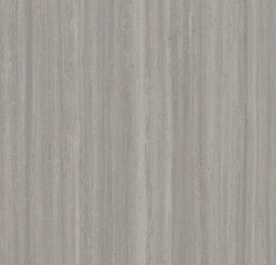 Forbo Marmoleum modular planks in 100x25cm, showcasing natural linoleum flooring with a textured surface and earthy tones.
