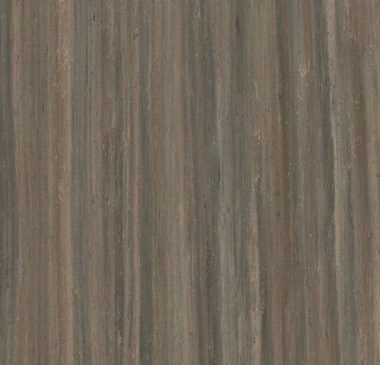 Forbo Marmoleum Modular Planks in 100x25cm, natural linoleum flooring with a wood-like appearance and warm color tones.