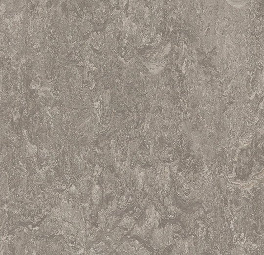 Forbo Marmoleum modular tiles in 50x50cm size, showing colorful, patterned flooring tiles arranged in a modern design.