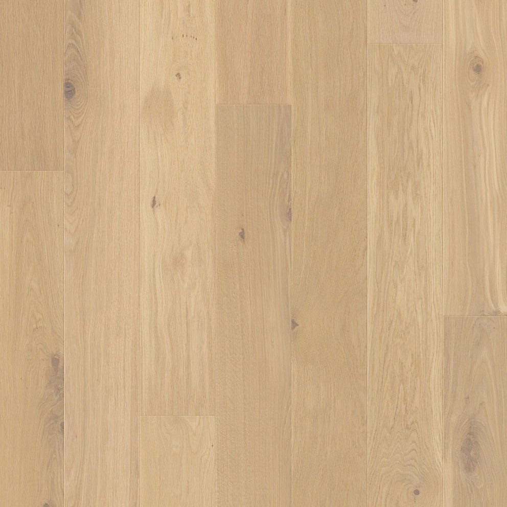 Quick-Step Palazzo hard wood flooring with warm oak planks, showcasing smooth, polished surface and natural wood grain details.