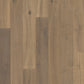 Quick-Step Palazzo hard wood flooring planks showing rich oak finish and textured surface for a stylish interior upgrade.