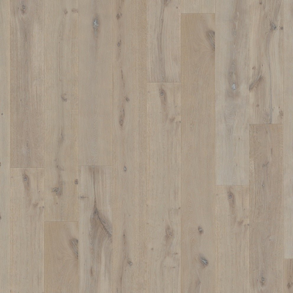 Close-up of Quick-Step Massimo hardwood flooring planks showcasing their rich wood grain and smooth finish.