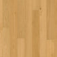 Close-up of Quick-Step Amato Hard Wood Flooring showing rich wood grain and smooth finish in natural light.