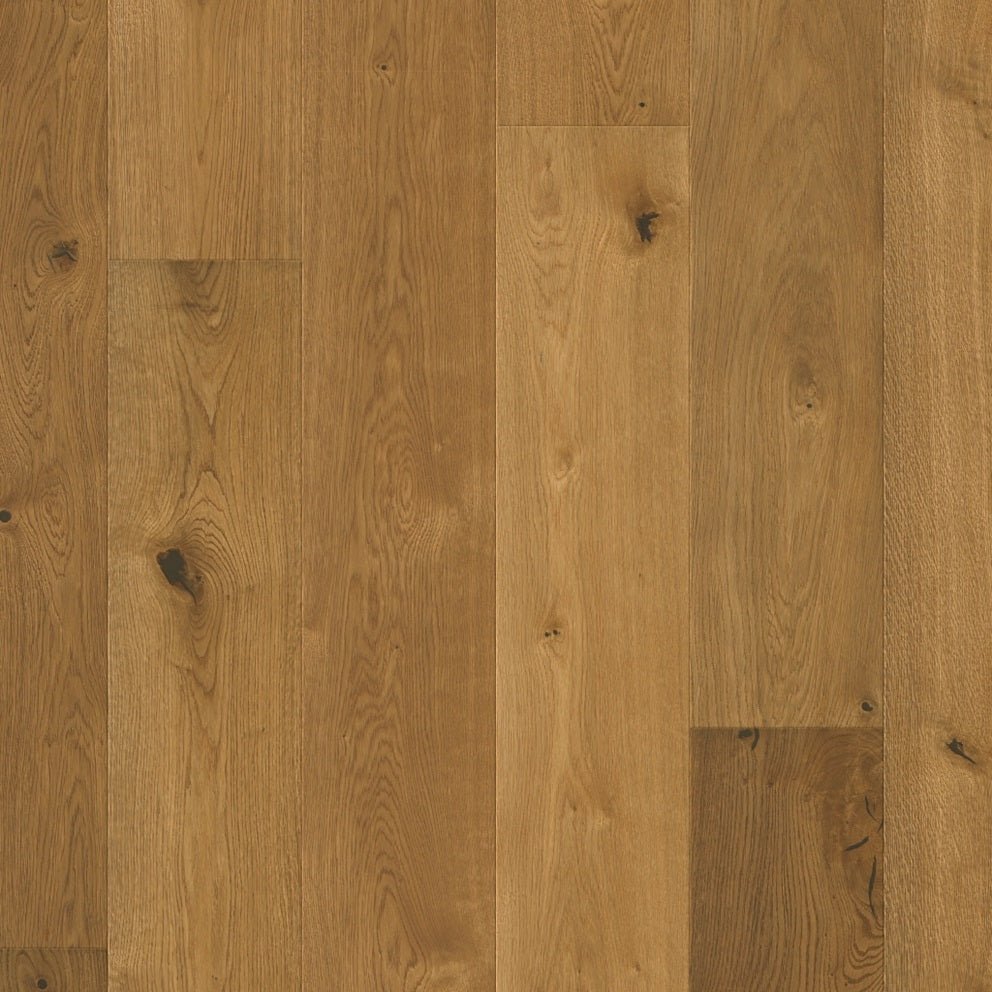 Quick-Step Cala hard wood flooring planks with natural wood grain and warm finish, showcasing durable hardwood surface.