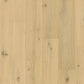 Quick-Step Cala hard wood flooring planks with a natural oak finish, showcasing smooth surface and beveled edges for installation.