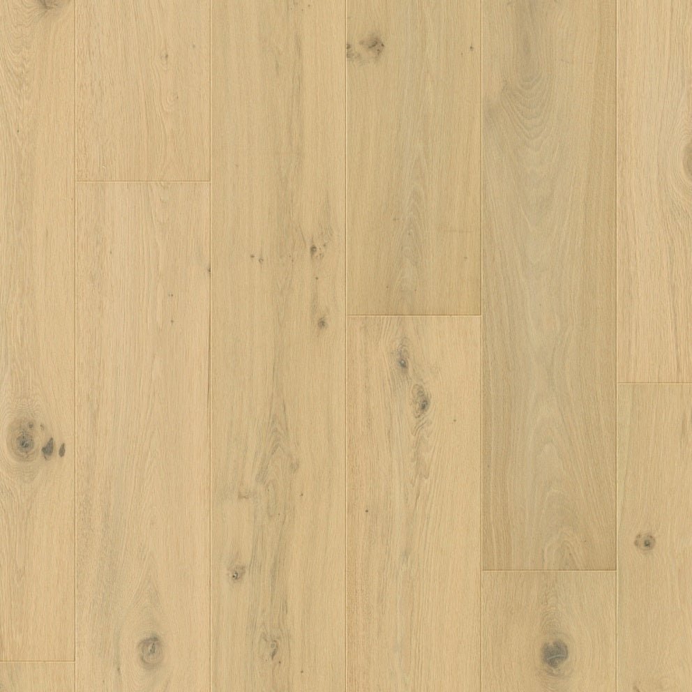 Quick-Step Cala hard wood flooring planks with a natural oak finish, showcasing smooth surface and beveled edges for installation.