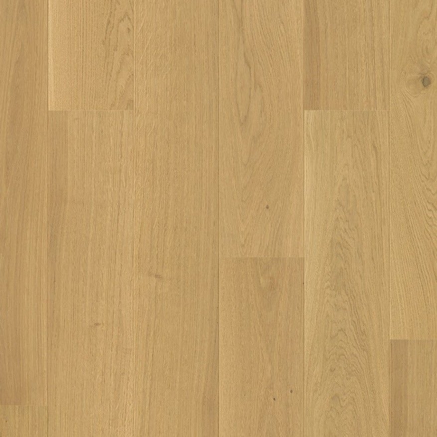 Quick-Step Cascada hardwood flooring planks with natural wood grain and warm brown tones, showcasing durable hard wood flooring.