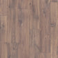 Quick-Step Classic laminate flooring planks with a natural wood finish, showcasing the durable and stylish flooring option.