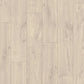Quick-Step Classic Laminate Flooring planks with a wood grain finish, showcasing durable laminate flooring design.