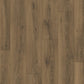 Quick-Step Classic laminate flooring planks with a wood grain finish, showcasing durable and stylish laminate flooring in natural tones.
