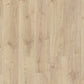 Quick-Step Creo laminate flooring planks in a natural wood finish, showcasing the textured surface and realistic wood grain pattern.