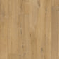 Quick-Step Impressive laminate flooring planks in a natural wood finish, showcasing the textured surface and detailed grain pattern.