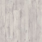 Quick-Step Impressive laminate flooring planks with wood grain texture and light oak finish, showcasing durable flooring for modern interiors.