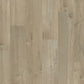 Quick-Step Impressive laminate flooring planks with natural wood grain texture and warm brown finish.
