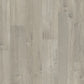 Quick-Step Impressive laminate flooring planks in a natural wood finish, showcasing the textured surface and realistic wood grain pattern.