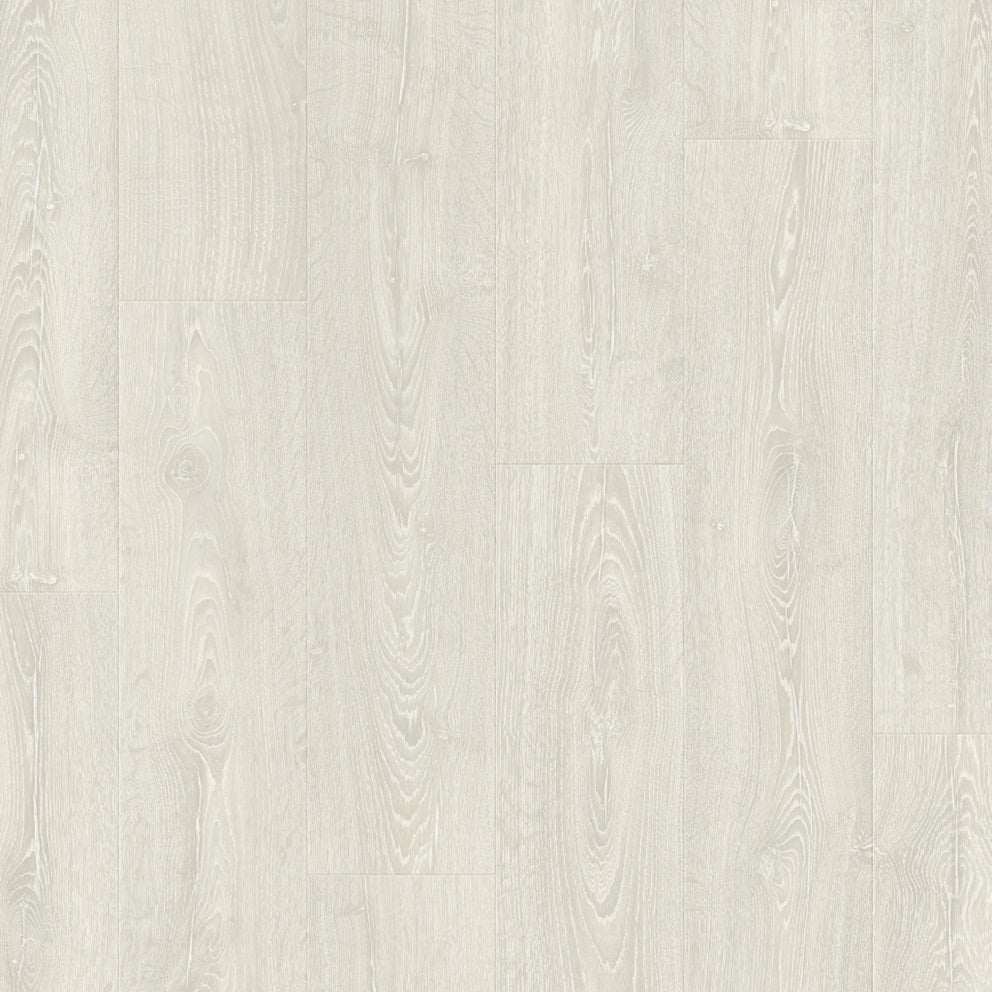 Quick-Step Impressive laminate flooring planks with a natural wood finish, showcasing the textured surface and elegant design.