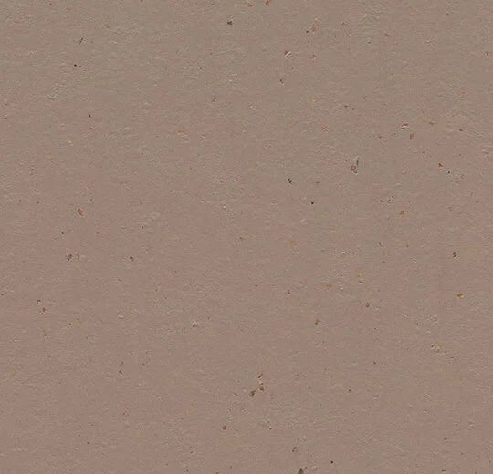 Marmoleum Solid Cocoa linoleum flooring by Forbo, showing a close-up of the textured, natural brown surface of the flooring.