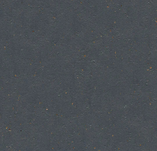 Forbo Marmoleum Solid Cocoa linoleum flooring with a natural, warm brown wood grain finish in a close-up view
