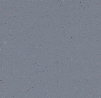Marmoleum Solid Cocoa linoleum flooring by Forbo showing a close-up of the textured brown surface.