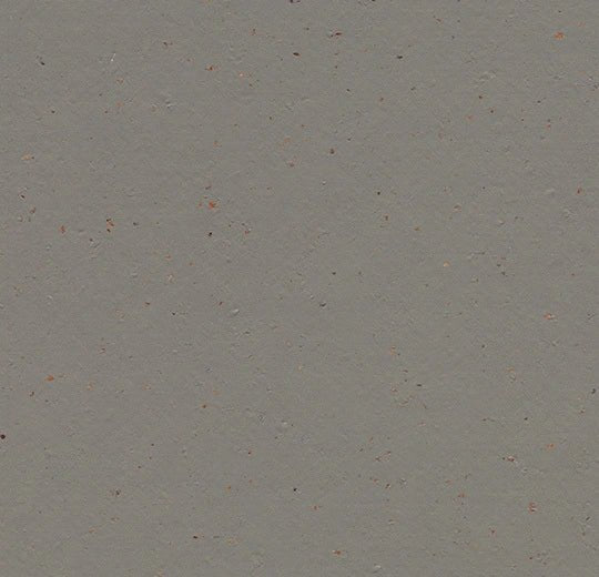 Marmoleum Solid Cocoa linoleum flooring by Forbo showing a close-up of textured, natural cocoa-colored flooring surface.