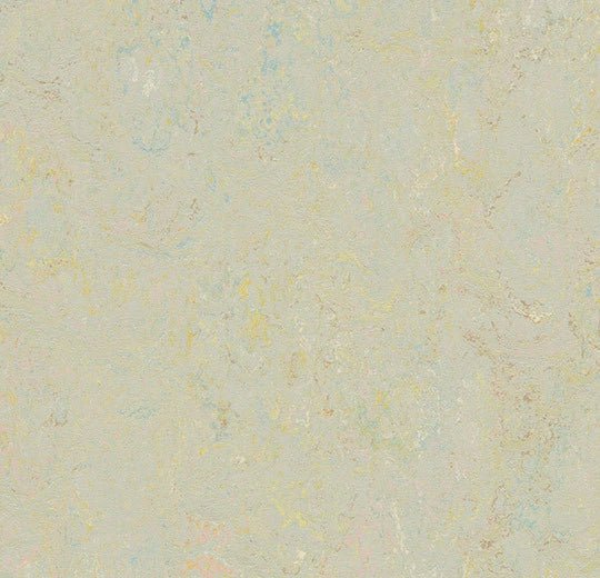 Marmoleum Splash linoleum flooring by Forbo with vibrant, colorful pattern in a close-up view of the textured surface.