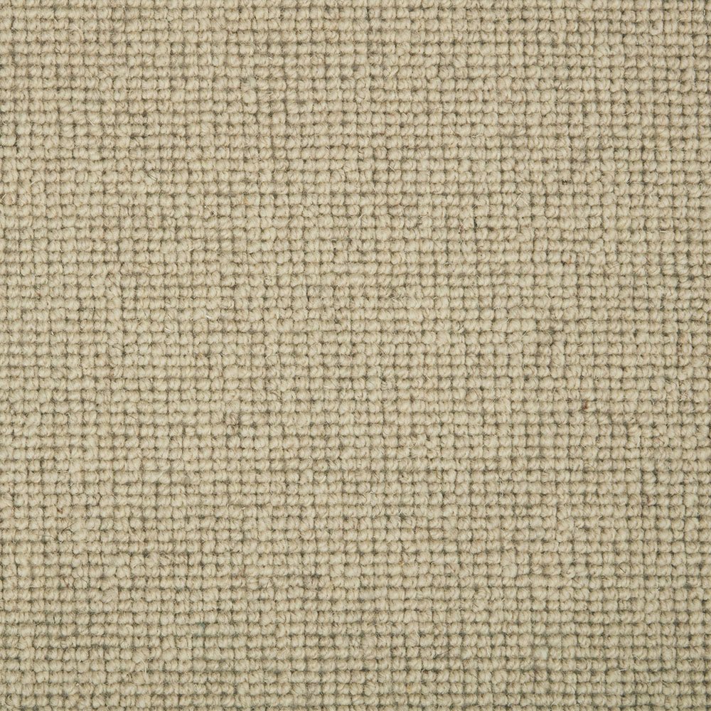 Close-up of Shetland Wool Loop Carpet by Cormar Carpet Co, showing textured wool loops in neutral tones.