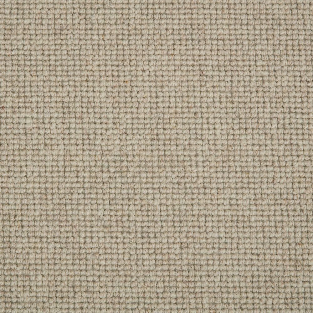 Shetland Wool Loop Carpet by Cormar Carpet Co showcasing textured, natural wool fibers in beige and brown tones.