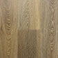 Spire Estyle Symphony Plank LVT flooring with wood-like finish and textured surface, showcasing a light brown, natural wood appearance.