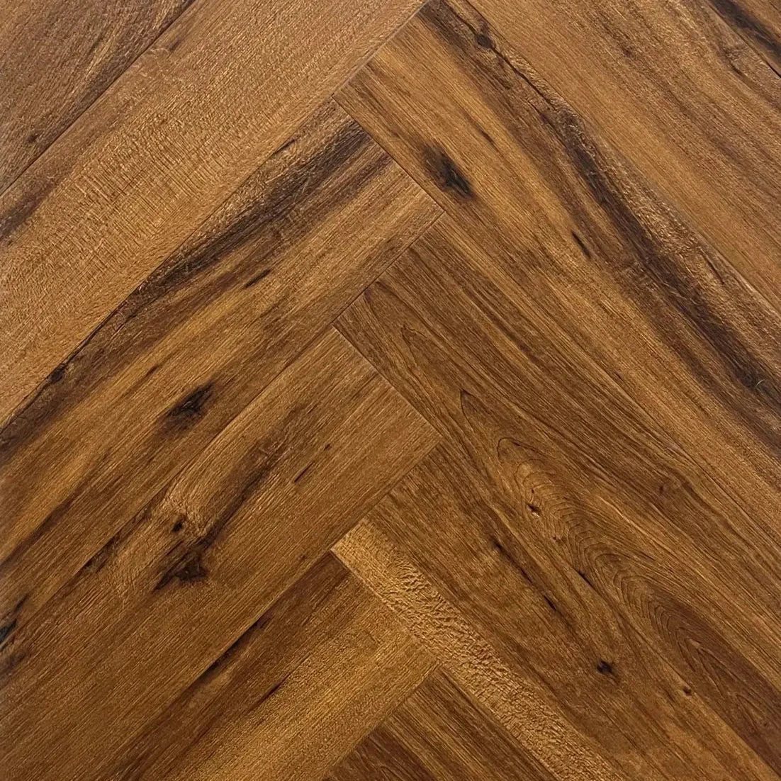 Spire Estyle Symphony herringbone LVT flooring with wood-like pattern and herringbone design for modern interior flooring.