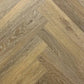 Spire Estyle Symphony Herringbone LVT flooring with wood-like pattern in a close-up view