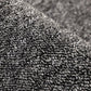 Surefit Carpets Essentials Rug with a soft, neutral-toned woven design suitable for living rooms and bedrooms.