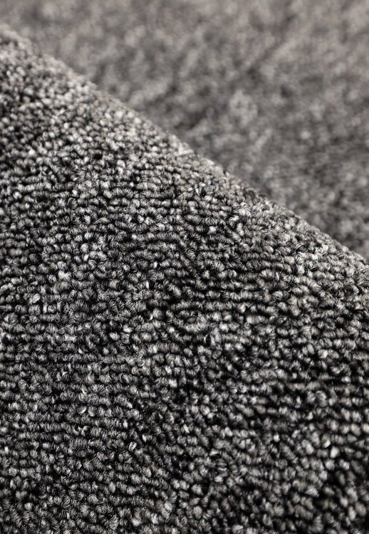 Surefit Carpets Essentials Rug with a soft, neutral-toned woven design suitable for living rooms and bedrooms.