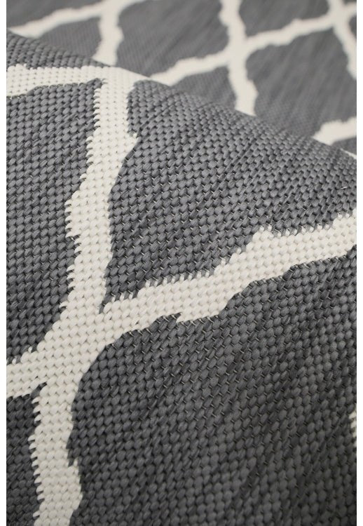 Surefit Carpets Alfresco Reverse Diamond Rug with geometric diamond pattern in neutral tones, plush textured surface.