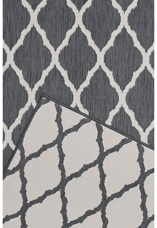 Surefit Carpets Alfresco Reverse Diamond Rug featuring a geometric diamond pattern in neutral tones.