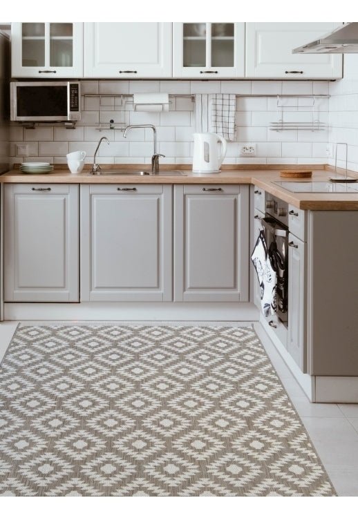 Surefit Carpets County Genesis Rug featuring intricate patterns and soft texture in neutral tones, ideal for living room decor.