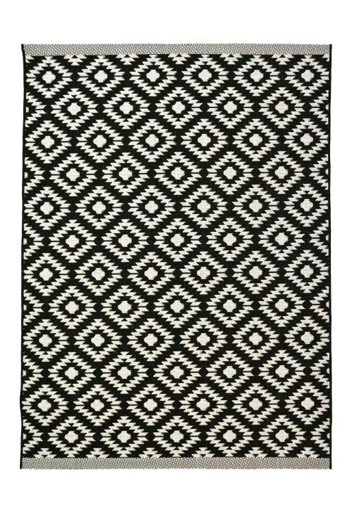 Colorful County Genesis rug by Surefit Carpets with intricate patterns, showcasing a soft, woven textile design.