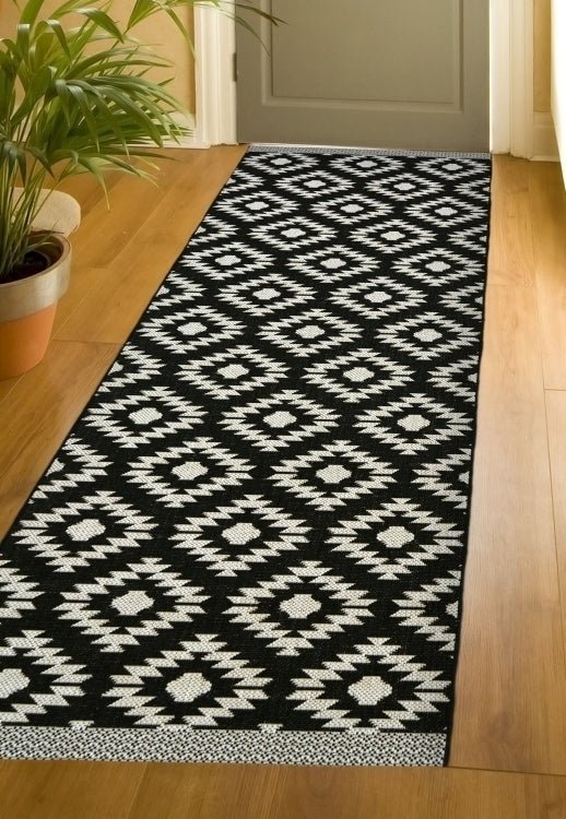 Surefit Carpets County Genesis Rug featuring intricate patterns and textured design in neutral tones.