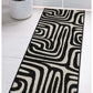 Surefit Carpets County Zebra Rug featuring a black and white zebra print design on soft woven fabric.