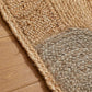 Surefit Carpets Naturals Circle Rug with soft, textured surface and neutral tones, perfect for modern living room decor.